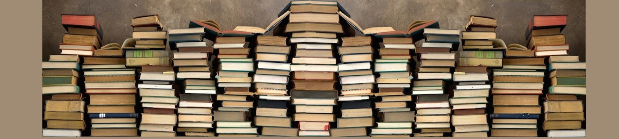 Piles of books seen from the bottom of the books. No titles visible. 