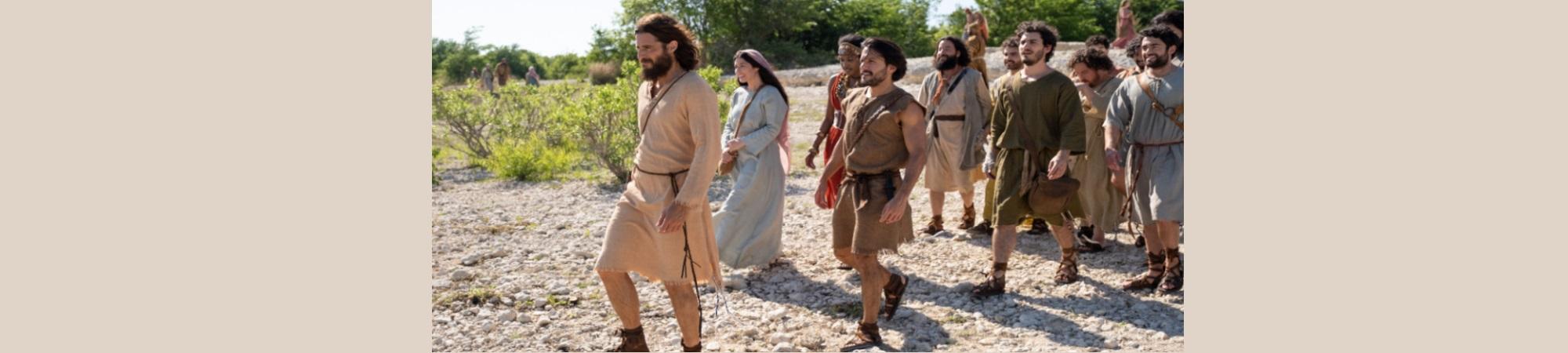 Image of Jesus walking with his disciples. 