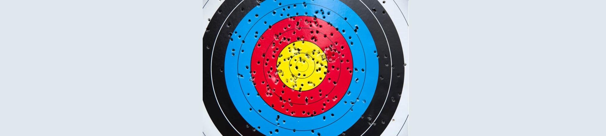 Archery target with many holes all over it