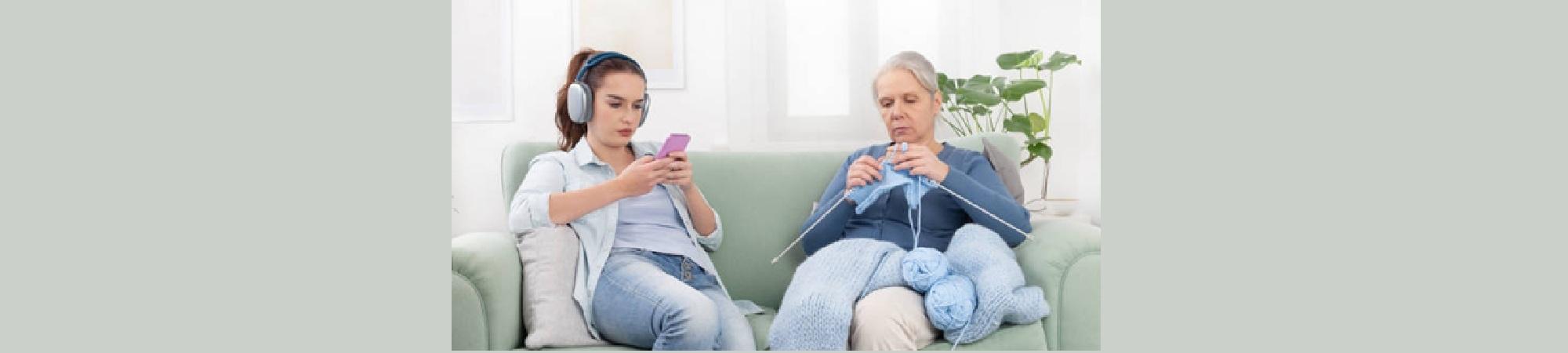 Granma knitting and daughter on cell phone. 
